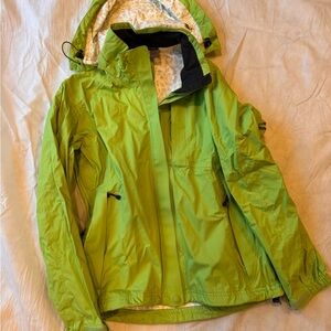 REI green Raincoat. Removable hood.